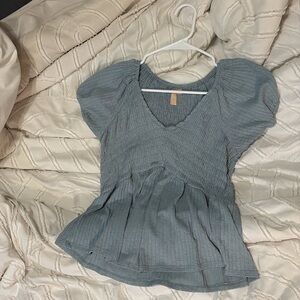 Tight fitting blouse but gets loose